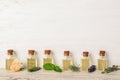 Glass bottles with different essential oils and herbs