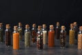 Glass bottles with different spices on table Royalty Free Stock Photo