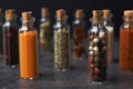 Glass bottles with different spices on table Royalty Free Stock Photo