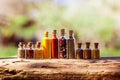 Glass bottles with different spices on wooden board Royalty Free Stock Photo