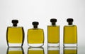 Glass bottles with extra virgin olive oil and intense yellow col