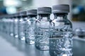 Glass bottles filled with liquid moving on a conveyor belt