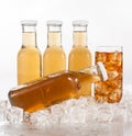 Glass bottles and glass with drink with ice Royalty Free Stock Photo