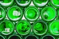 Glass bottles green. Green glass bottles of beer. Wall formed by green bottles. Green bottles background. Empty Glass Royalty Free Stock Photo