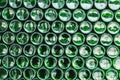 Glass bottles green. Green glass bottles of beer. Wall formed by green bottles. Green bottles background. Empty Glass Royalty Free Stock Photo