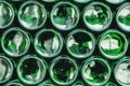 Glass bottles green. Green glass bottles of beer. Wall formed by green bottles. Green bottles background. Empty Glass Royalty Free Stock Photo