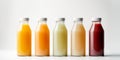 Glass bottles with juice and smoothies of different colors isolated on a white background Royalty Free Stock Photo