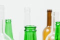 Glass bottles of mixed colors including green, clear white, brow Royalty Free Stock Photo