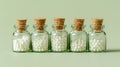 Glass bottles with white homeopathic pills on teal background. Homeopathy medicine. Concept of alternative medicine Royalty Free Stock Photo