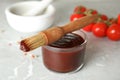 Glass bowl of barbecue sauce with basting brush Royalty Free Stock Photo