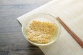 Glass bowl , chopsticks and instant noodle on the wooden table Royalty Free Stock Photo