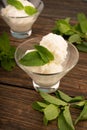 Glass bowl with delicious ice cream and mint leaves Royalty Free Stock Photo