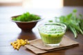 glass bowl of edamame soup with sprig of cilantro Royalty Free Stock Photo