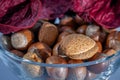 A glass bowl filled with assorted Christmas nuts