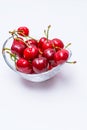 The glass bowl filled with ripe cherries Royalty Free Stock Photo