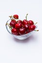 The glass bowl filled with ripe cherries Royalty Free Stock Photo