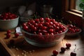 Glass bowl filled with ripe red cherries placed on a wooden table Royalty Free Stock Photo