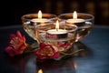 glass bowl with floating tea light candles