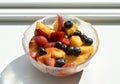 Glass bowl of fresh cut fruit salad Royalty Free Stock Photo