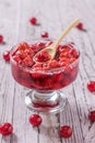 Glass bowl with fresh homemade cherry jam on wooden table. Royalty Free Stock Photo