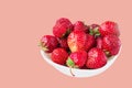 Glass bowl with fresh ripe strawberries, space for text, copy space isolated on pink background, layout, clipping Royalty Free Stock Photo