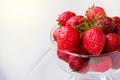 Glass bowl with fresh ripe strawberries, space for text, copy space, white background, mockup Royalty Free Stock Photo