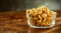 Glass bowl of fresh roasted salted peanuts