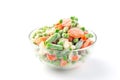 Glass bowl with frozen vegetables isolated on white, green peas, carrot, cauliflower,  green beans Royalty Free Stock Photo