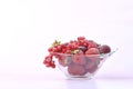 Glass bowl full of frozen red fruit Royalty Free Stock Photo