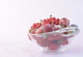 Glass bowl full of frozen red fruit Royalty Free Stock Photo