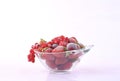 Glass bowl full of frozen red fruit Royalty Free Stock Photo
