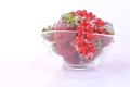 Glass bowl full of frozen red fruit Royalty Free Stock Photo