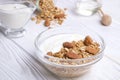 Glass bowl with Greek yogurt and mixed nuts. Healthy sports vegetarian protein rich diet, homemade granola breakfast with milk, ho Royalty Free Stock Photo