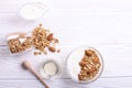 Glass bowl with Greek yogurt and mixed nuts. Healthy vegetarian protein rich diet, homemade granola breakfast with milk, almond, c Royalty Free Stock Photo