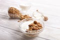 Glass bowl with Greek yogurt and mixed nuts. Healthy vegetarian protein rich diet, homemade granola breakfast with milk, almond, c Royalty Free Stock Photo