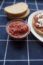 Glass bowl with homemade tomato sauce. Slices of wholemeal bread Royalty Free Stock Photo