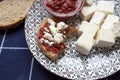 Glass bowl with homemade tomato sauce. Slices of wholemeal bread and white cheese Royalty Free Stock Photo