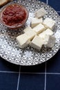 Glass bowl with homemade tomato sauce. Slices of wholemeal bread and white cheese. Close up Royalty Free Stock Photo