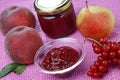 Glass bowl with peach jam and peach fruit,currant,