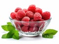 Glass bowl with raspberries and green leaves Royalty Free Stock Photo