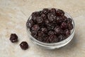 Glass bowl with red dried cherries close up Royalty Free Stock Photo