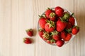 Glass bowl with ripe strawberries on white table, top view. Space for text Royalty Free Stock Photo