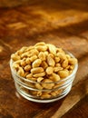 Glass bowl of roasted peanuts or groundnuts