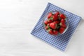 Glass bowl with sweet ripe strawberries on white wooden table Royalty Free Stock Photo