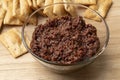 Glass bowl with traditional homemade black olive tapenade