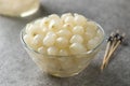 Glass bowl with traditional pickled silverskin onions Royalty Free Stock Photo