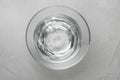 Glass bowl with water on grey table, top view Royalty Free Stock Photo