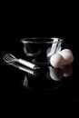 Glass bowl whisker eggs side view with reflection vertical black Royalty Free Stock Photo