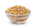 Glass bowl of whole unhulled oats grains