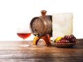 Glass of brandy, barrel, old paper on a white background Royalty Free Stock Photo